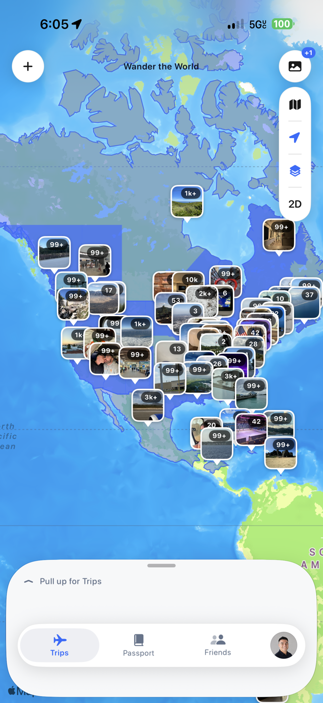 Wandered on iPhone: the same globe with photo pins from the camera roll